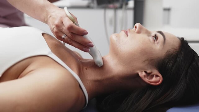 Thyroid ultrasound examination shown in close-up during a diagnostic procedure in a modern medical clinic. Concept thyroid health, ultrasound diagnostics, endocrinology, preventive medicine, medical i