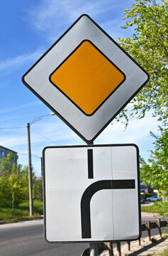 Priority, direction and turn road sign
