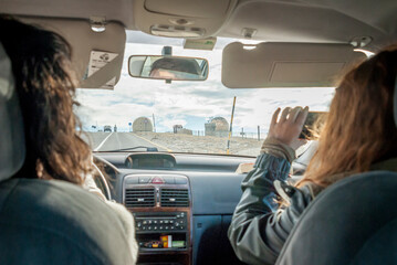 People in car driving toward abandoned radar station dome on Serra da Estrela in Portugal © Elsworth Frobisher