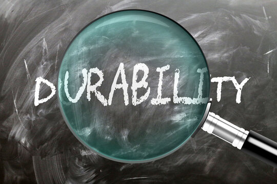 Durability - learn, study and inspect it. Taking a closer look at durability. A magnifying glass enlarging word 'durability' written on a blackboard ,3d illustration