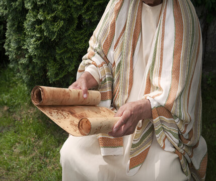 Old man reading the scroll