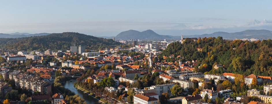 Panorama aerial view of Ljubljana, Slovenia capital city, highlighting the skyline, Ljubljanica river and old castle.