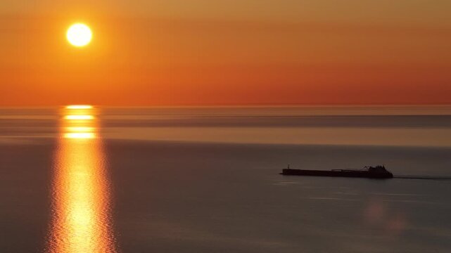 Ship sails into Lake Superior Sunset in the Upper Peninsula of Michigan