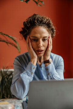 Woman experiencing stress, burnout, and fatigue while working