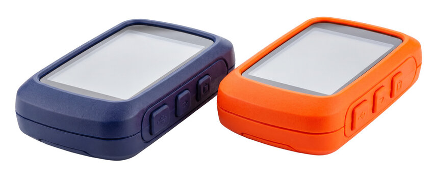 GPS navigation device cycling computer with silicone protective cases in orange and blue color isolated on black background, blank screen mockups for outdoor sports tracking and route planning tool.