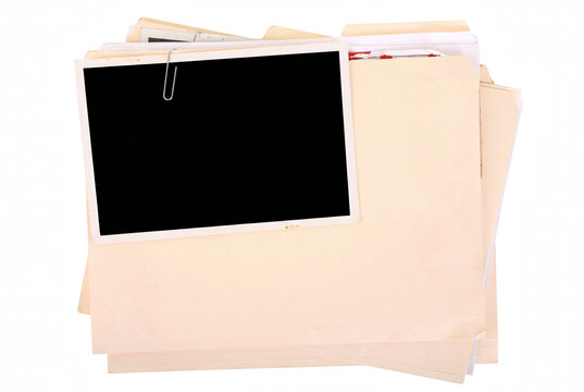 Stack of Manila Folders with a Clipped Blank Photo Frame
