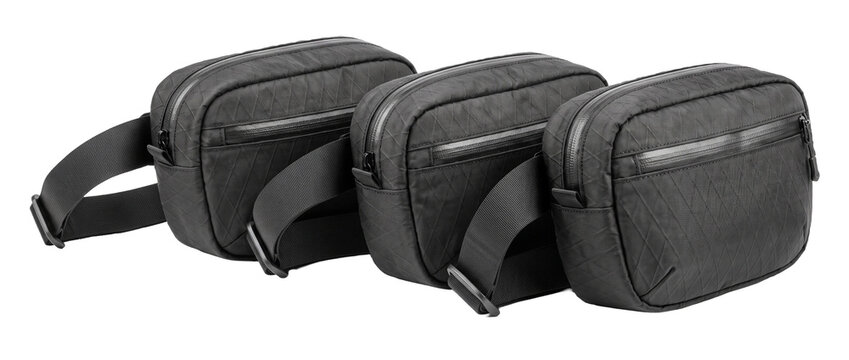 Three black waist bag fanny pack tactical sling bags with waterproof zippers and adjustable straps for outdoor travel, EDC gear, and urban techwear fashion, isolated on a clean solid black background.