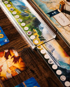 Portrait macro product photography of Lord of the Rings Duel Middle Earth showing ring hunt gameplay representation designed by Antoine Bauza and Bruno Cathala