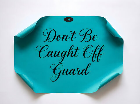 Don't Be Caught Off Guard Motivational Quote On Elegant Teal Curled Paper Tag With Minimal White Background For Business Awareness And Personal Development Concept