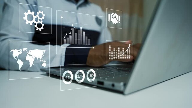 Businessman using a laptop with digital dashboard icons charts and world map animation on the screen, Hologram online business data analysis technology and remote work