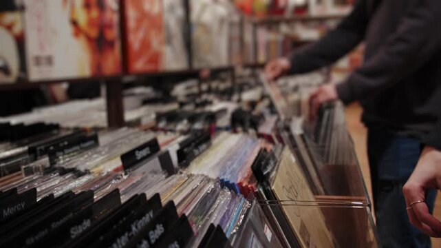 Man browsing vinyl records in store