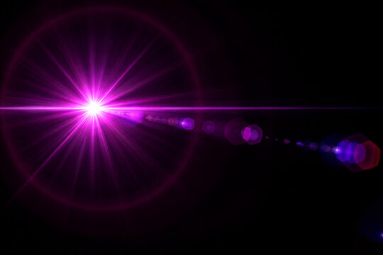 Purple pink lens flare effect with starburst rays and circular bokeh on black background.