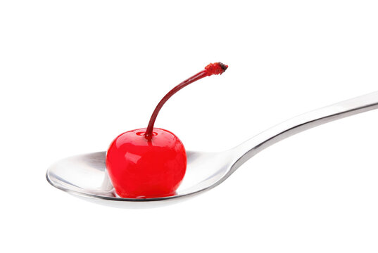 Single Vibrant Red Cherry Resting on a Metallic Spoon