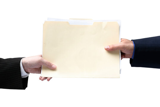 Business Professionals Exchanging Manila File Folder and Documents