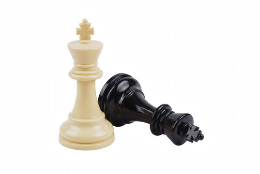 White Chess King Standing Over Toppled Dark King