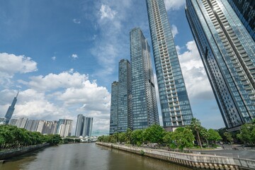 Obraz premium Waterfront towers at 2 Ton Duc Thang with Landmark 81 supertall skyscraper on horizon, Ho Chi Minh City, Vietnam
