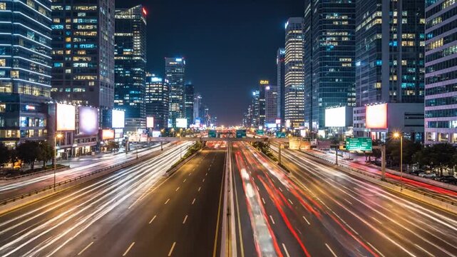 Night Highway Traffic in a Modern City: Streaks of car headlights and taillights create a vibrant light trail on a multi-lane highway at night.