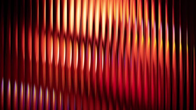 Red abstract video loop with orange vertical ribbed glass texture and shiny glowing gradient light energy. Vibrant red and orange abstract background video featuring a dense striped glass texture 