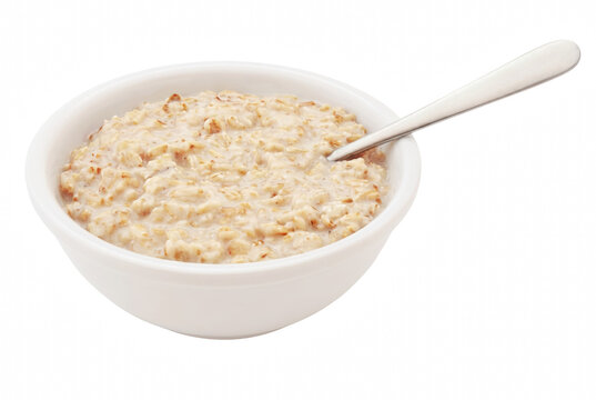 Warm Oatmeal Porridge in a White Bowl with a Spoon
