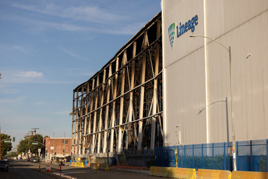 Los Angeles, California, USA - July 3, 2026: Afternoon sun heats the burnt aftermath of the Lineage warehouse fire in Boyle Heights.