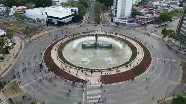 Guadalajara, Mexico - January 25 2026: Dynamic advancing drone view captures Minerva Roundabout in Guadalajara, showcasing urban activity, architecture, vibrant city life.