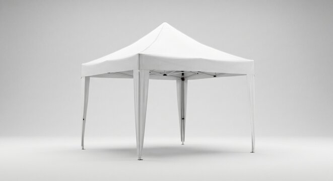 White pop up canopy tent standing empty, showing its clean fabric roof and sturdy metal frame structure for outdoor events and exhibitions