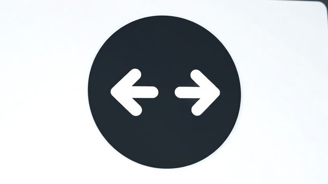 Abstract minimalist image showing two white arrows in a black circle on white