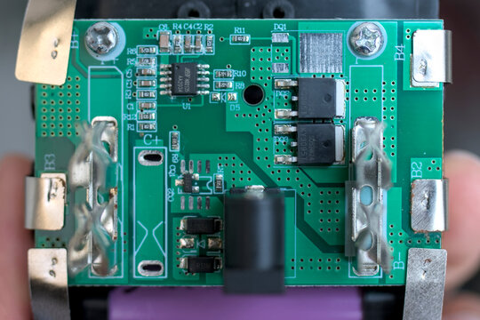 Top view macro of a green printed circuit board for custom battery hardware engineering