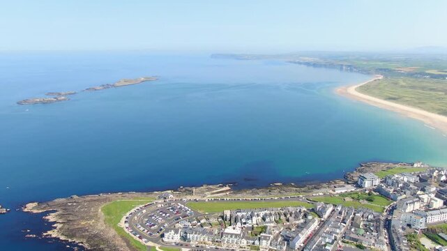 Aerial View of Portrush, Northern Ireland Coastal town on Coast of Atlantic Ocean. Drone Video of Beach and Buildings 