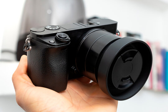 Mirrorless digital camera with lens, hobby photography concept