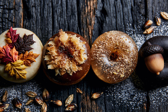 elegant Thanksgiving themed donuts in a row