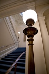 Obraz premium Elegant staircase with glowing lamp indoors