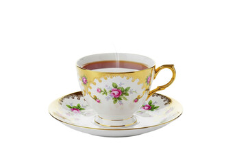 Fototapeta premium A vintage porcelain teacup with pink roses and gold gilding filled with steaming black tea, isolated on a transparent background. Concept for beverage advertising