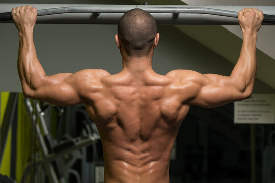 Bodybuilder Doing Pull Ups Best Back Exercises
