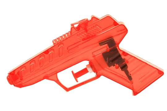 red plastic toy ray gun 
