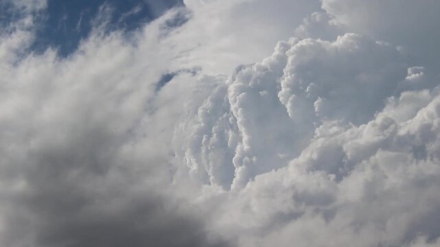 Billowing thunderheads grow rapidly in the sky in this time lapse footage.