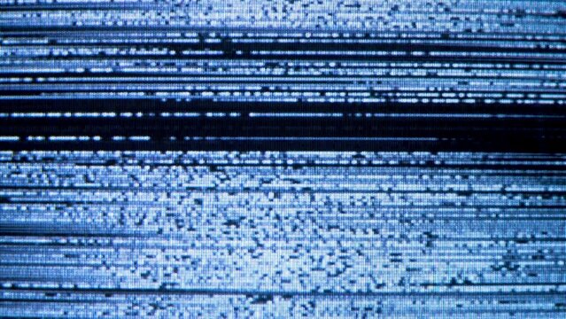 Close up of a television screen with blue and white static, depicting a broken signal or analog tv noise.