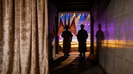 Behind the Velvet Curtain: Two figures stand in silhouette at the entrance of a dimly lit corridor, looking towards the vibrant, illuminated stage of a circus performance. © AstraFrameStudio.com