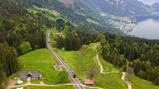 Cogwheel train climbing up Rigi mountain in Switzerland