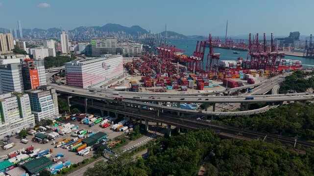 July 11 2026 Red gantry cranes load huge global container ships