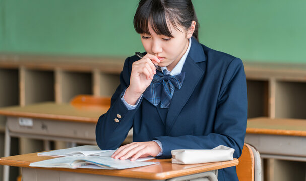 Middle school, elementary school, and high school students diligently studying in school classrooms and cram schools.