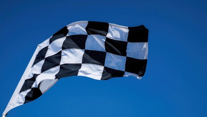 Obraz premium Detailed view of a checkered flag in a blue sky.
