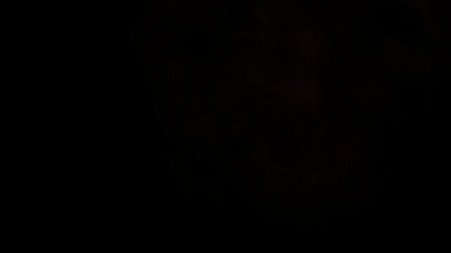 Intense fiery bomb explosion and expanding fire burst on black background. Cinematic roaring flames animation. Destructive inferno VFX element.