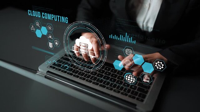 Hands Typing on Laptop with Cloud Computing Graphics and Data Visualizations representing technology, information sharing, and digital innovation in modern workspace. Entropy.