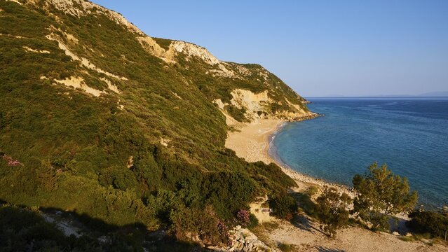 Koroni Beach, lonely beach, north of the island, cliff, blue cloudless sky, Kefalonia Island, Ionian Islands, Greece