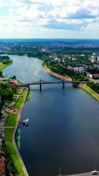 Vertical video. Panorama of the city of Tver, Russia. Drone footage. Volga River, Old Bridge. Drone footage. Rich colors