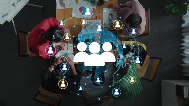 Diverse Team Collaboration in an Office Setting with Digital Network Connection and Communication Icons Showing Teamwork and Innovation. Entropy.