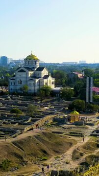 Vertical video. Sevastopol, Crimea. Vladimirsky Cathedral in Chersonesos. Chersonesus Tauric - founded by the ancient Greeks on the Heracles peninsula on the Crimean coast. Drone footage. Rich colors