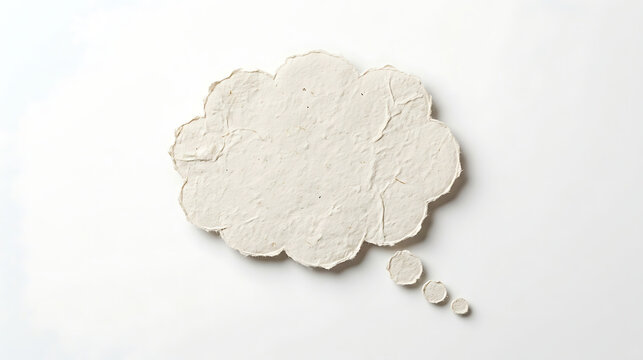 Handmade paper thought bubble icon on plain white background with communication dialogue thinking creative background brainstorm stationery isolated conceptual inspiration business planning