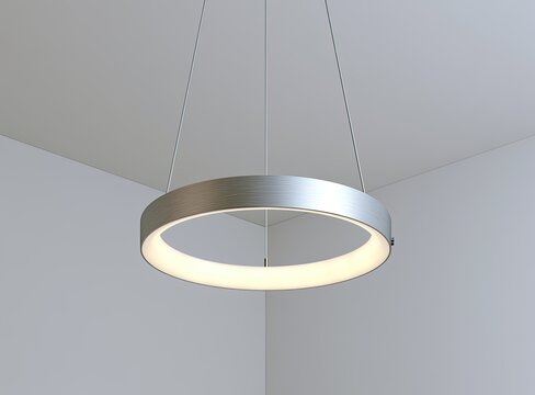 Modern circular LED light fixture with brushed metal finish suspended from ceiling
